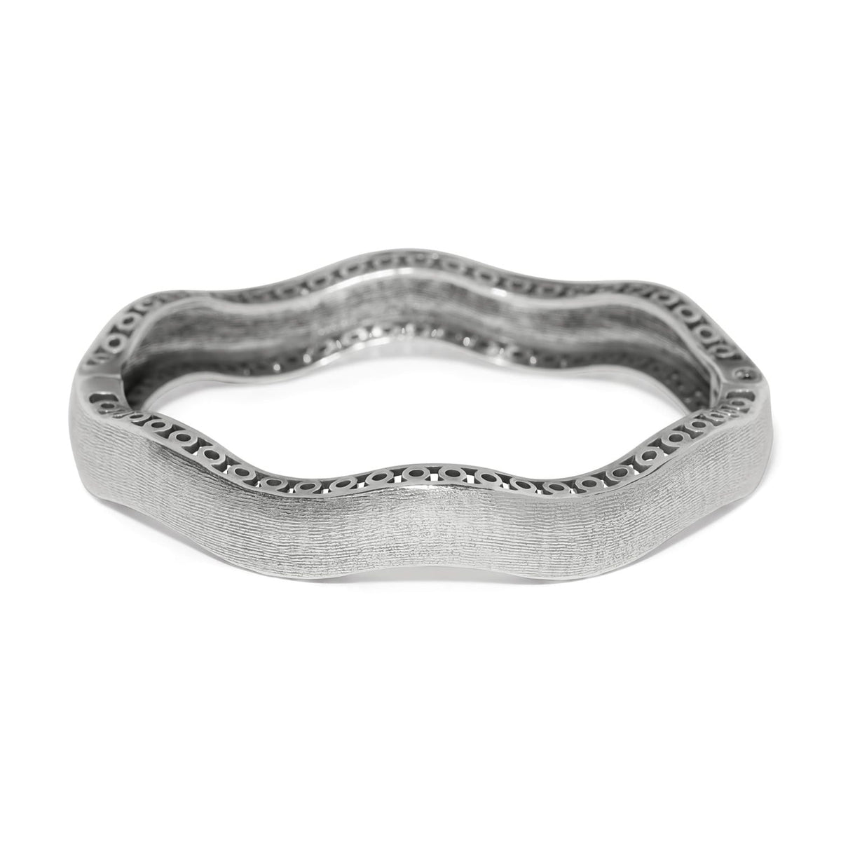 Brighton bangle bracelet with wavy silver-plated design, textured finish, and openwork edge detail on a white background