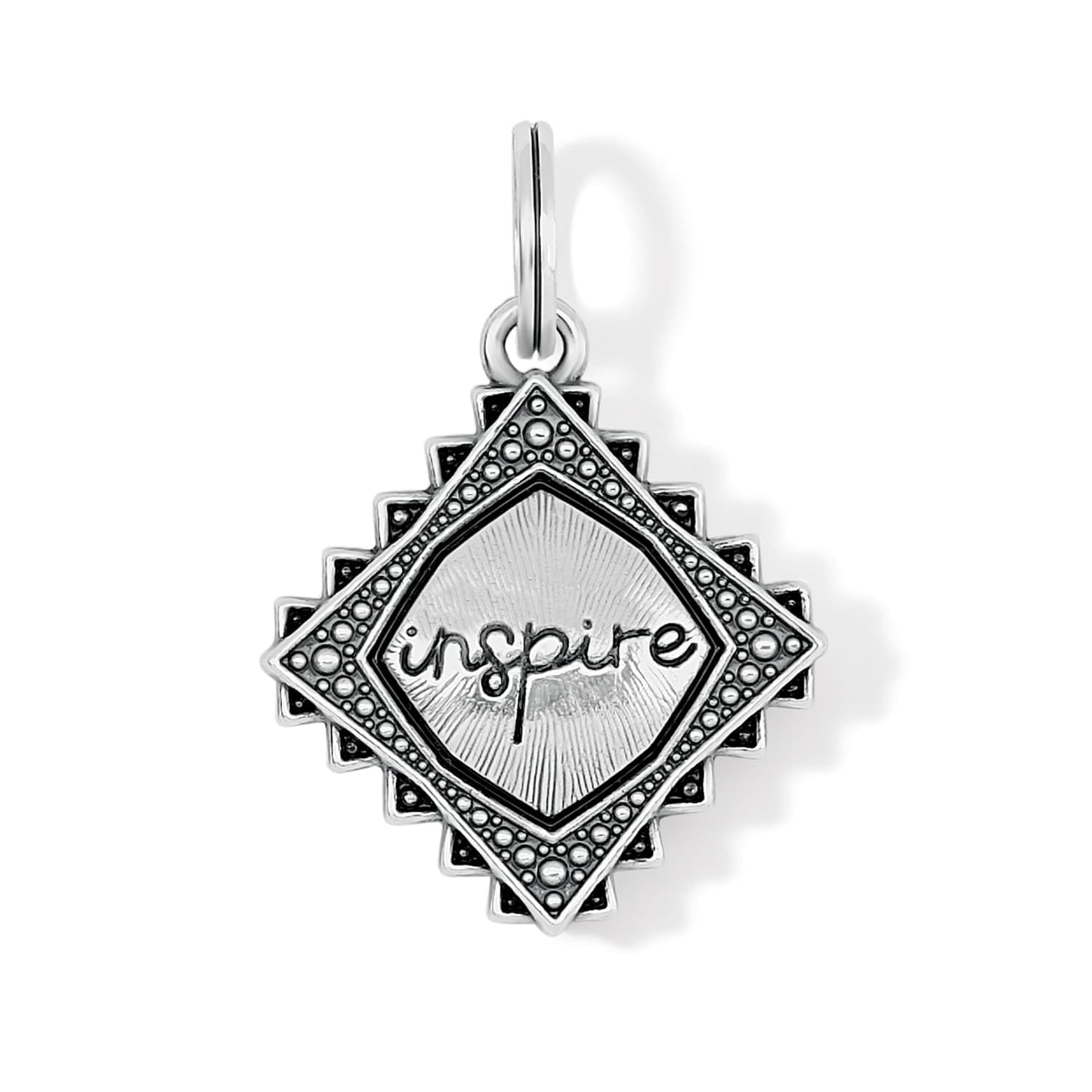 Brighton charm with silver-plated diamond-shaped medallion, beaded border, and engraved inspire text on a white background