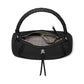 Brighton black leather handbag shown open with braided top handle, patterned interior lining, and knotted tassel on a white background