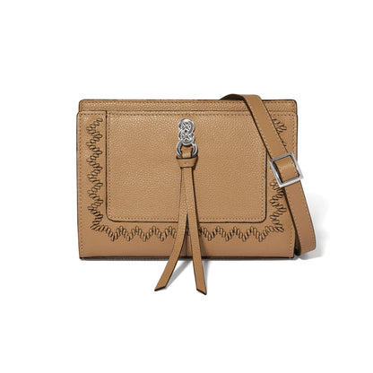 Brighton crossbody handbag in tan leather with whipstitch trim, silver-tone knot accent, and adjustable strap on a white background