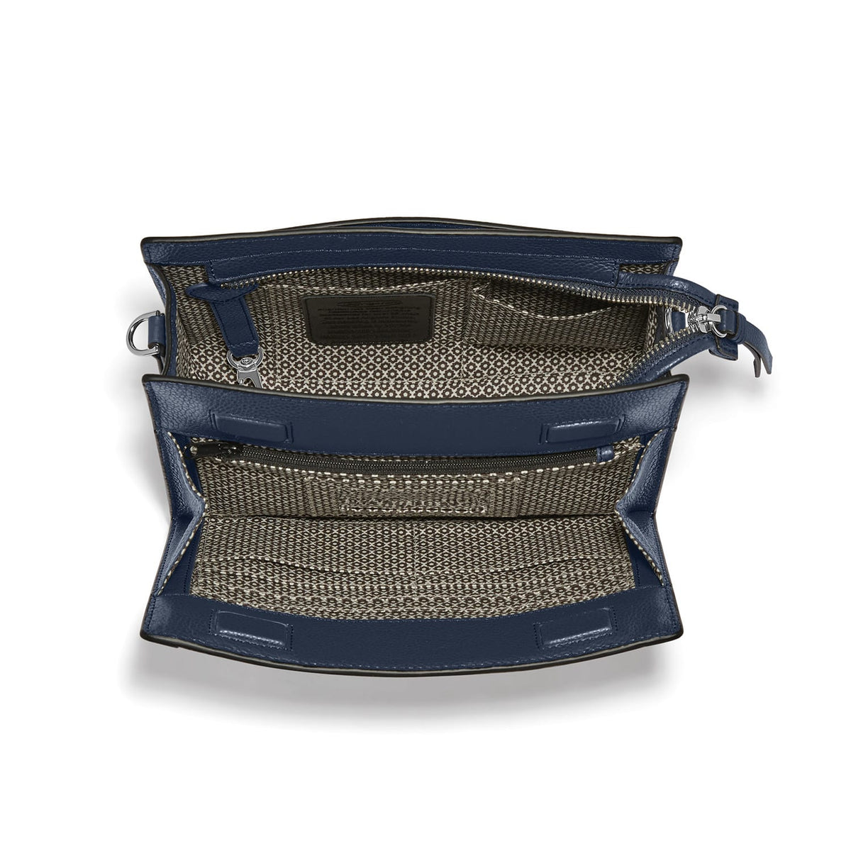 Brighton navy leather handbag shown open with patterned fabric interior, zip pocket, and silver-tone hardware on a white background