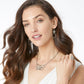 Model wearing Brighton silver-plated butterfly necklace paired with matching Celtic knot drop earrings and open ring