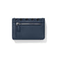Brighton navy leather wallet shown from the back with zippered pocket and woven trim detail on a white background