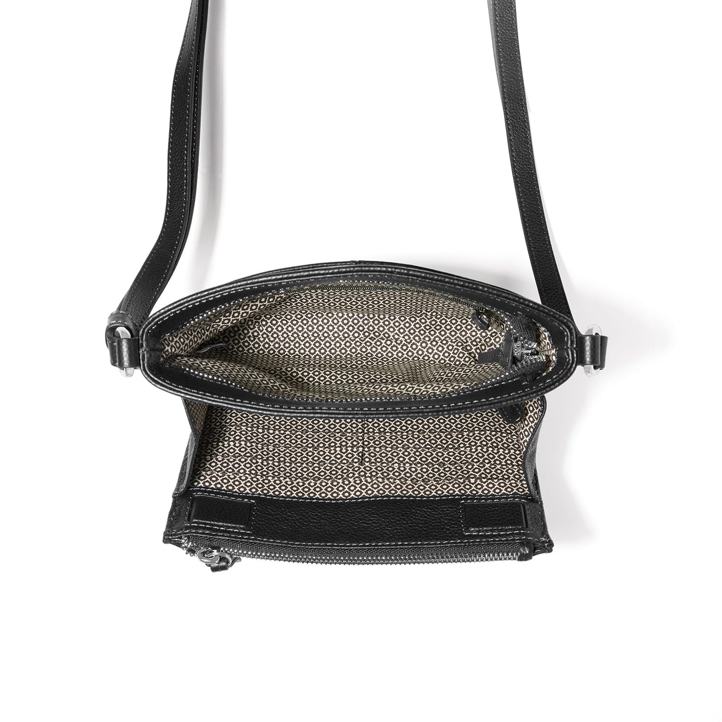 Brighton black leather crossbody handbag shown open with patterned interior lining and adjustable strap on a white background