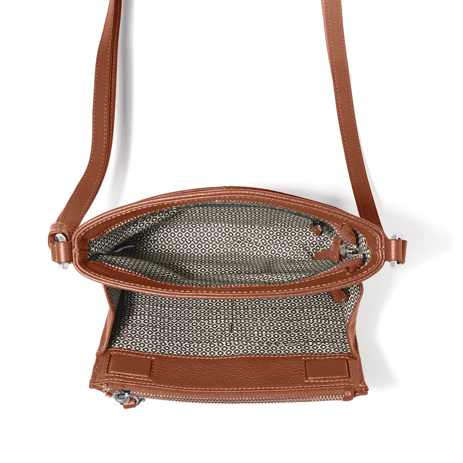 Brighton brown crossbody handbag shown open with patterned interior lining and adjustable strap on a white background