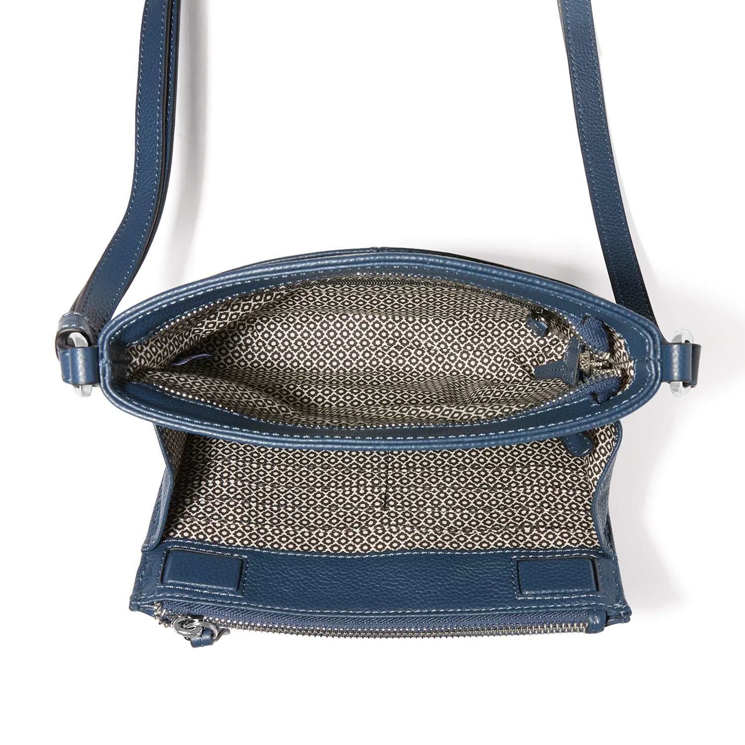 Close-up of Brighton blue leather handbag shown open revealing patterned fabric interior lining and zipper closure