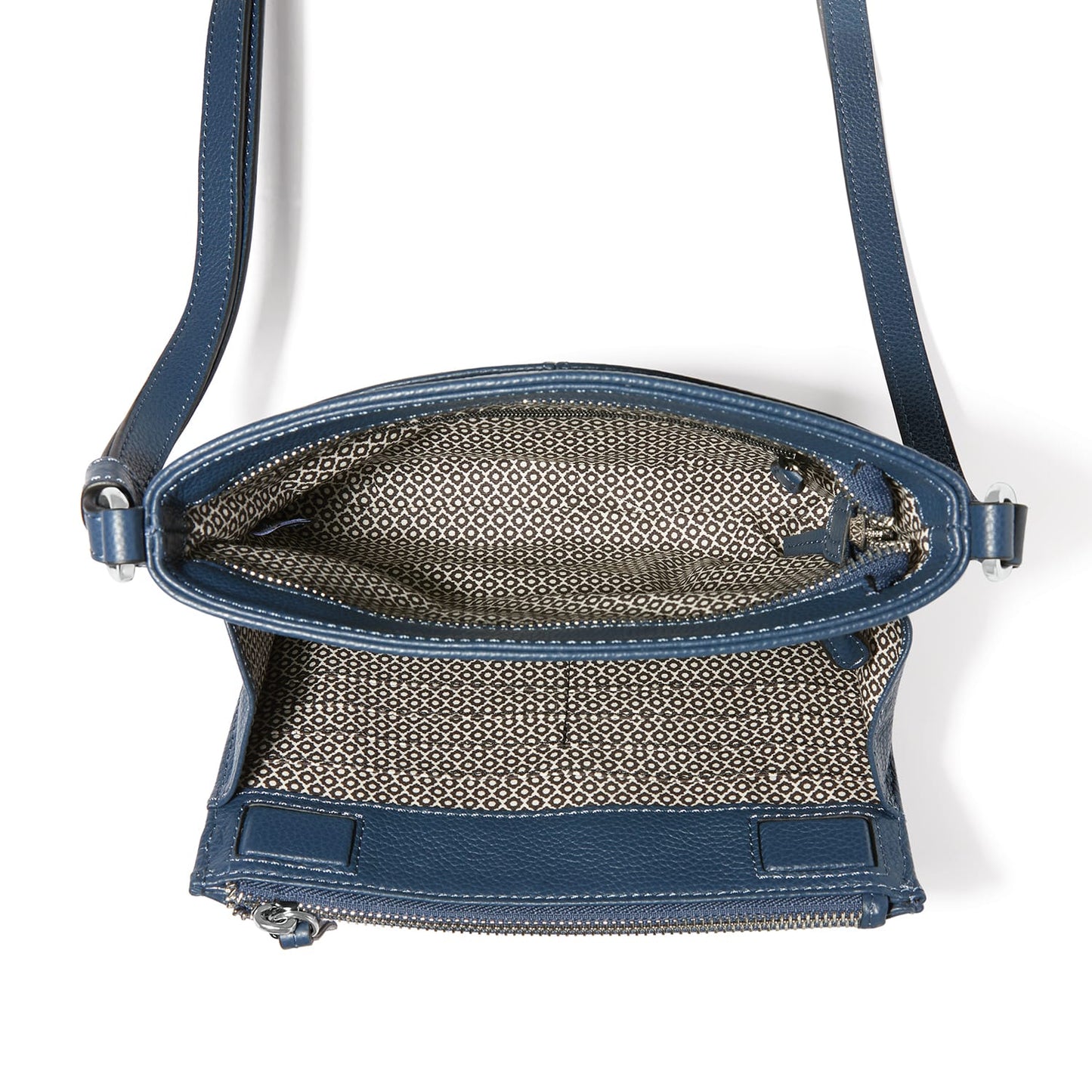 Close-up of Brighton blue leather handbag shown open revealing patterned fabric interior lining and zipper closure