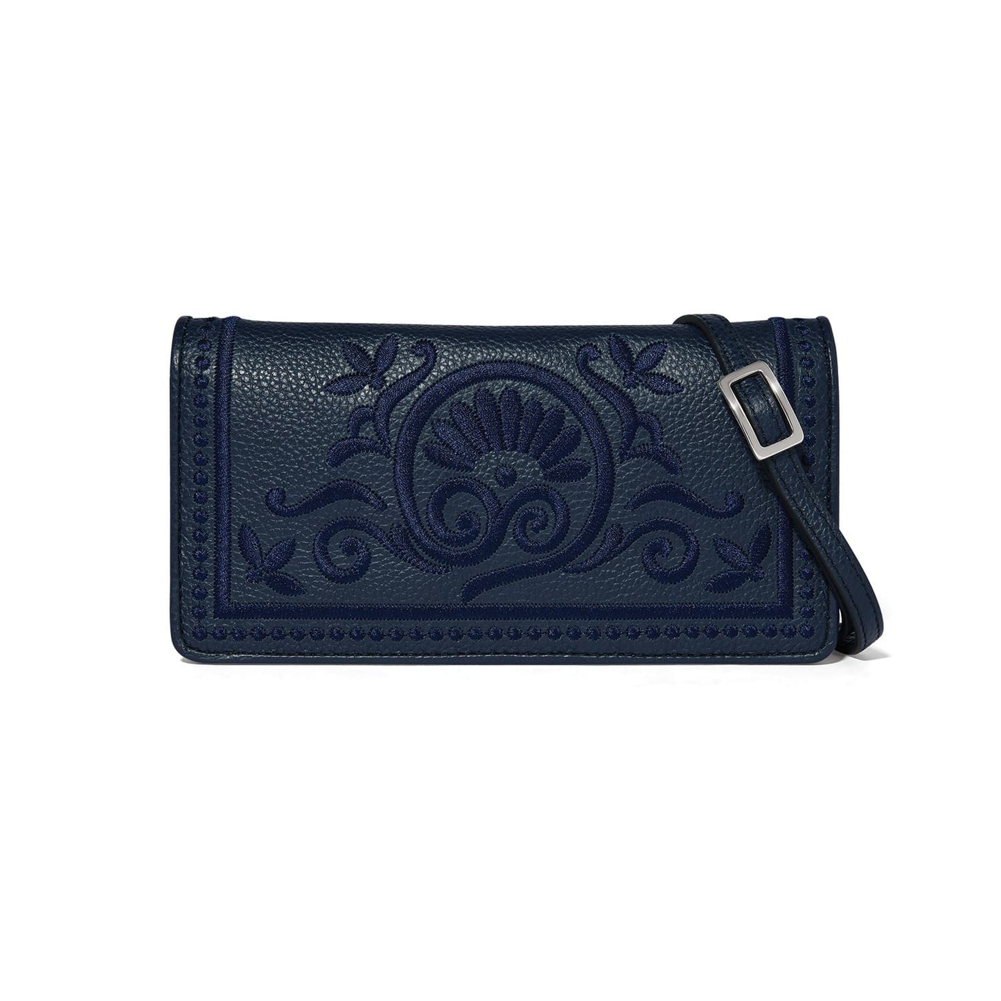Brighton crossbody handbag in navy blue with embroidered floral scroll design and adjustable strap on a white background