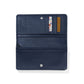 Brighton navy leather wallet shown open with interior card slots, billfold compartment, and snap closure on a white background