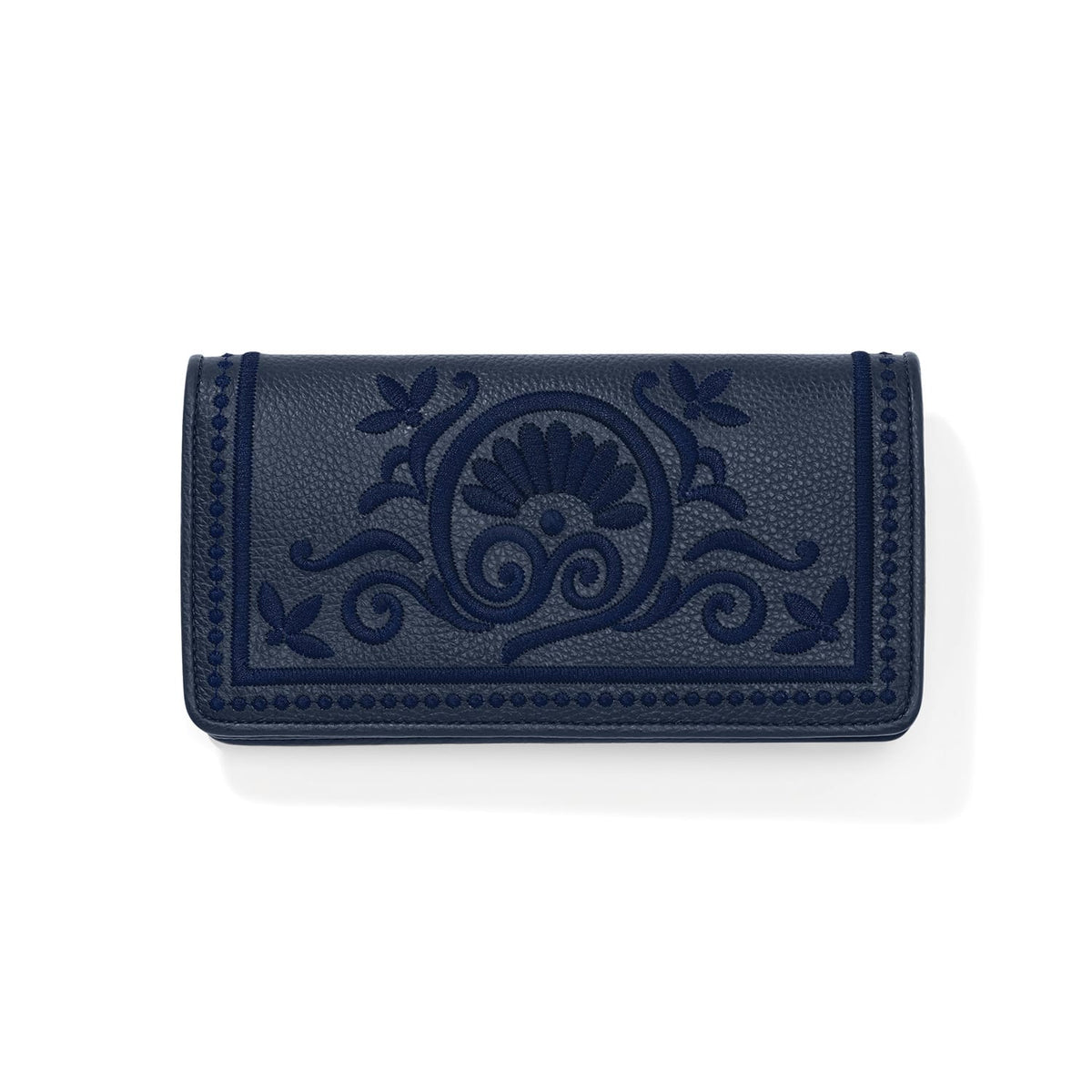 Brighton wallet in navy pebbled leather with tonal embroidered floral scroll medallion and dotted border on a white background