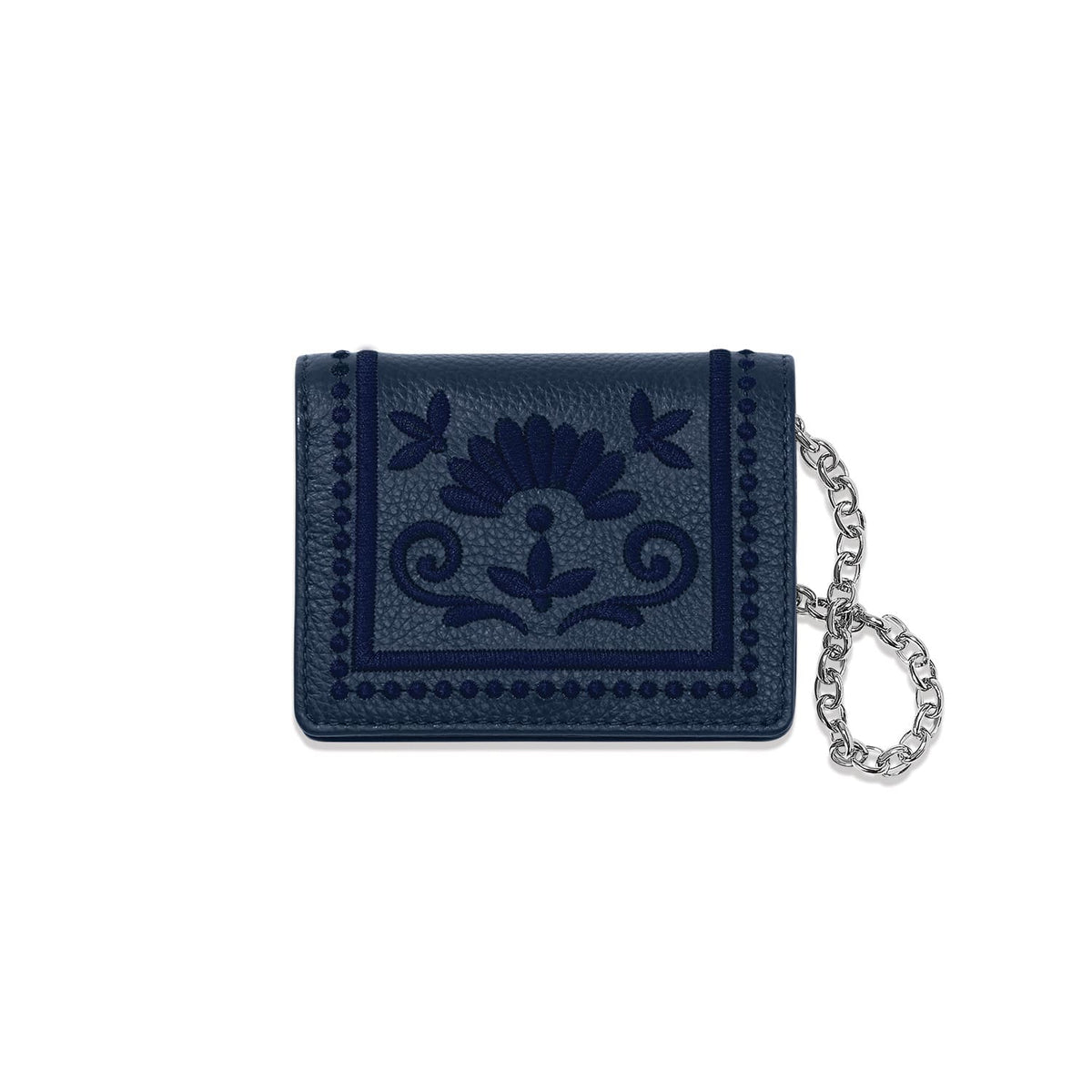 Brighton navy leather wallet with embroidered floral medallion design and silver-tone chain wristlet on a white background