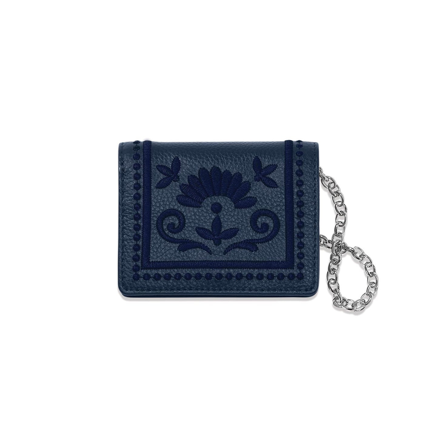 Brighton navy leather wallet with embroidered floral medallion design and silver-tone chain wristlet on a white background