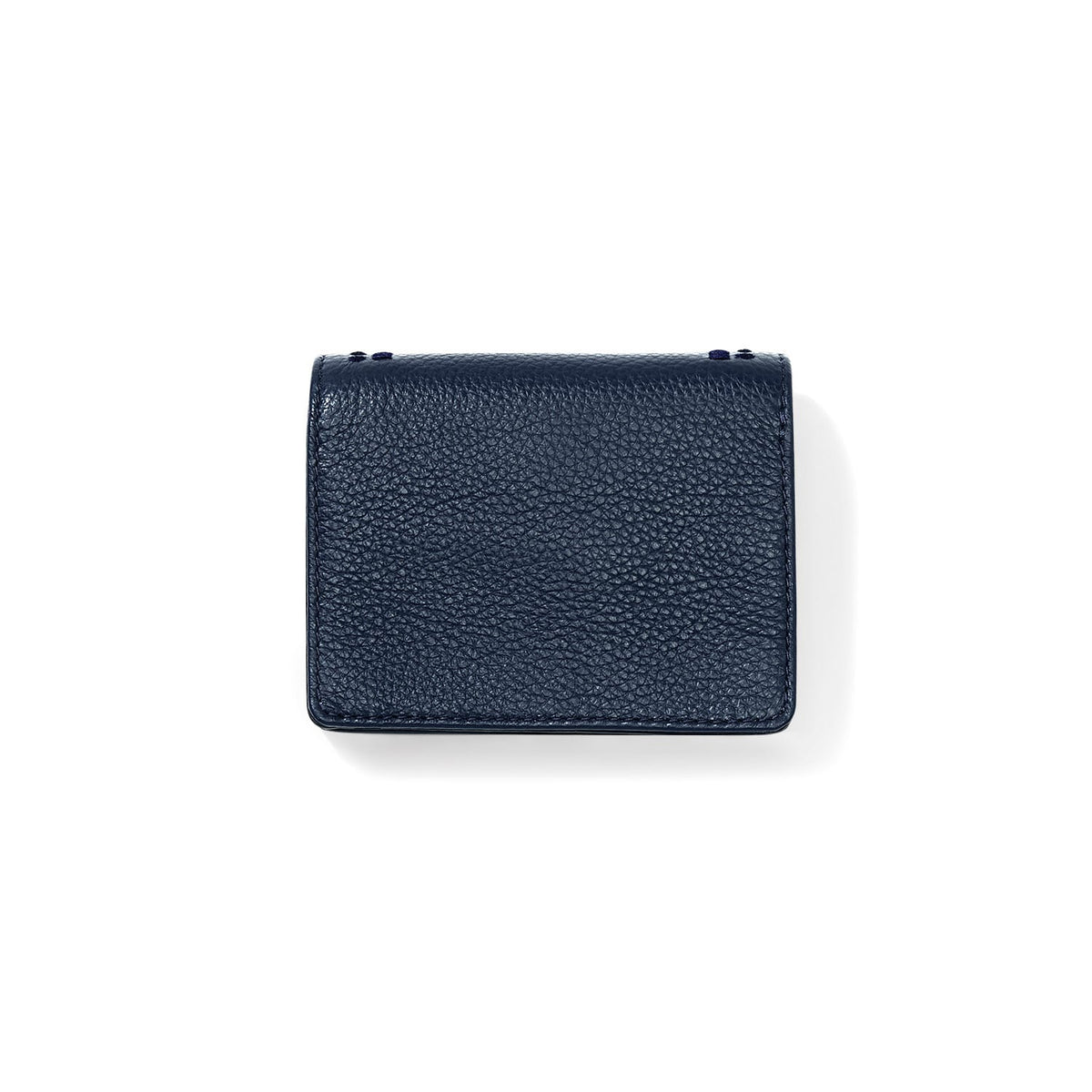 Brighton wallet shown from the back in navy pebbled leather with stitched edges on a white background