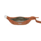 Brighton orange leather belt bag shown open with patterned interior lining and silver-tone buckle on a white background