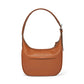 Brighton handbag shown from the back in tan leather with whipstitched shoulder strap and slip pocket on a white background