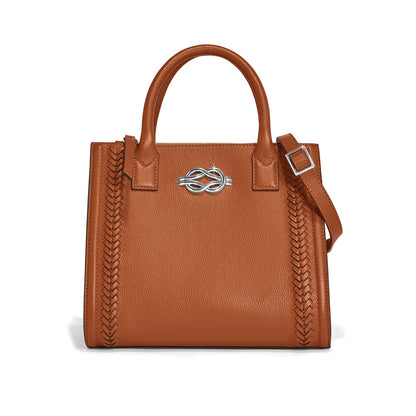 Brighton handbag in tan leather with braided side panels, silver-tone knot clasp, and adjustable strap on a white background
