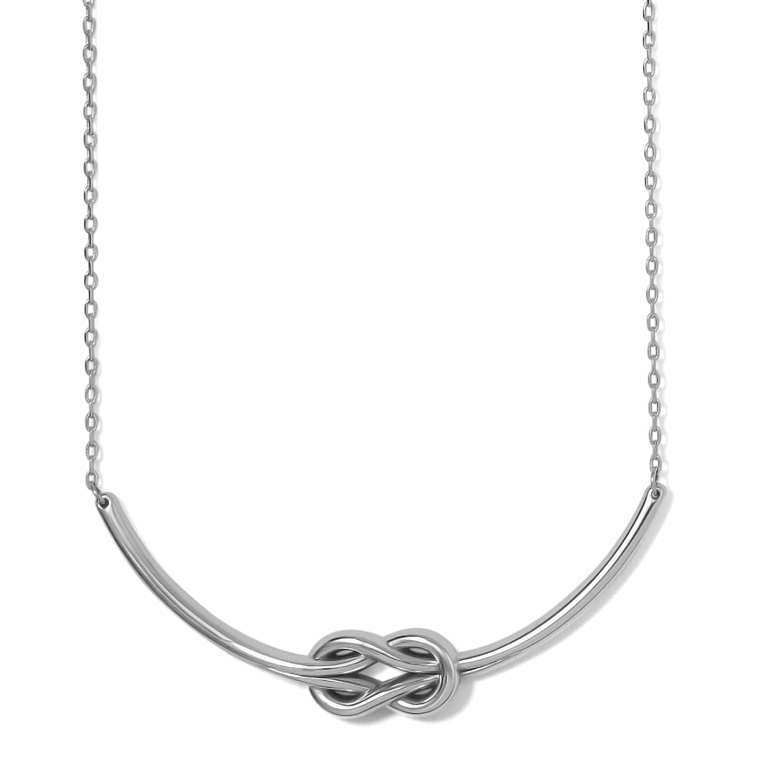 Brighton necklace with silver-plated curved bar featuring a central love knot design and delicate chain on a white background