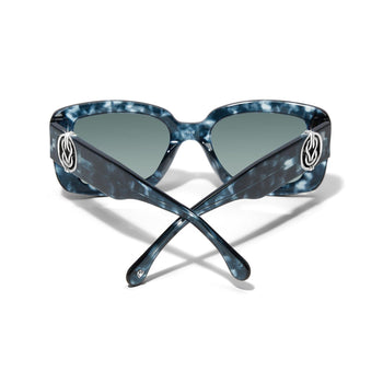 Brighton sunglasses shown from the back with blue marbled frames, gradient lenses, and silver-tone knot accents on a white background