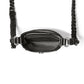 Close-up of Brighton black handbag interior view with patterned fabric lining and braided leather crossbody strap