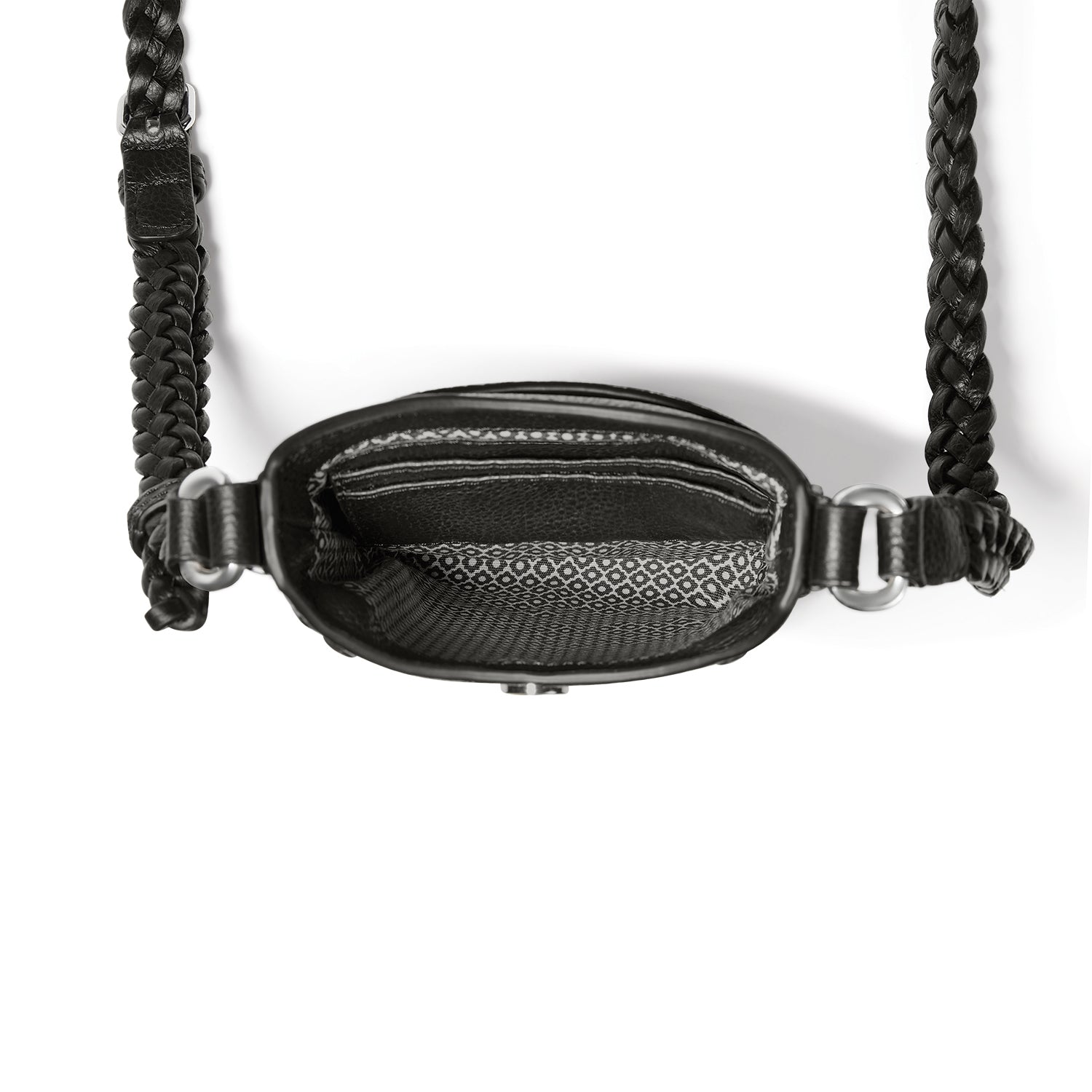 Close-up of Brighton black handbag interior view with patterned fabric lining and braided leather crossbody strap