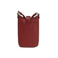 Brighton handbag shown from the side in red pebbled leather with braided strap and silver-tone hardware on a white background