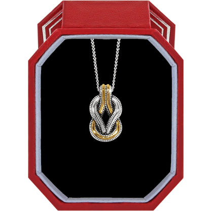 Brighton two-tone knot pendant necklace with silver and gold interlocking loops displayed in a red gift box