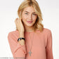 Model wearing a Brighton silver-plated cross pendant necklace with woven design and coordinating Brighton accessories
