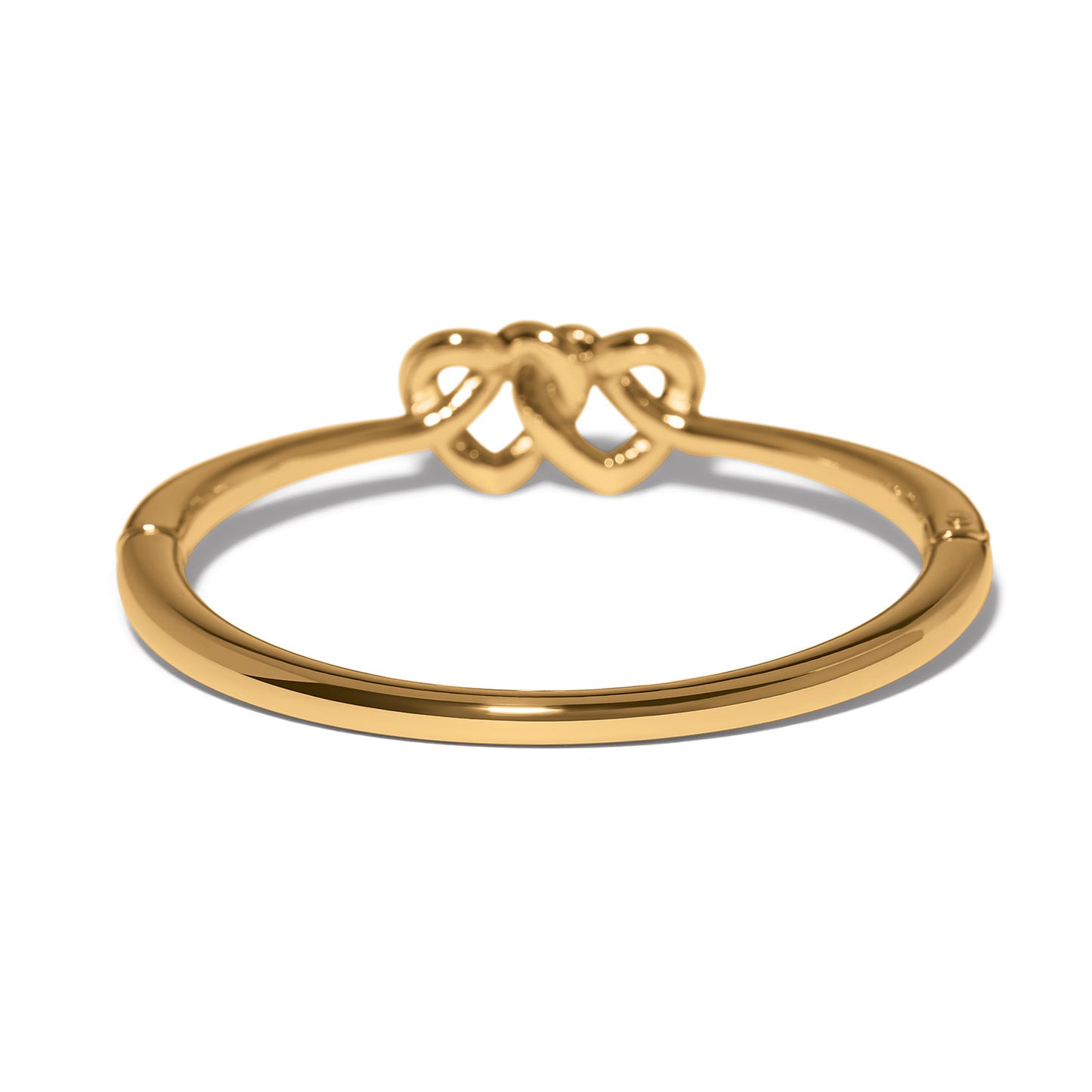 Brighton gold-plated ring shown from the back with interlocking double heart design on a white background