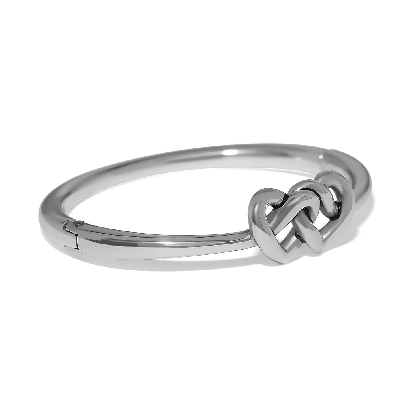Brighton bangle bracelet with silver-plated finish and interlocking heart knot centerpiece on a white background