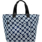 Brighton tote handbag with navy and white Celtic knot print, black woven handles, and front pocket on a white background