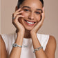 Model wearing a Brighton silver-plated crystal pendant necklace with coordinating Brighton bracelets and ring accessories