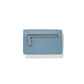 Brighton light blue pebbled leather wallet shown from the back with silver-tone zippered pocket on a white background