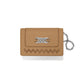 Brighton tan leather card case with silver-tone knot emblem, zigzag stitching, and chain wristlet on a white background