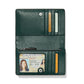 Brighton wallet shown open with green pebbled leather interior, card slots, zip pocket, and ID window on a white background