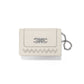 Brighton cream leather card case with silver-tone Celtic knot emblem, woven stitch detail, and chain loop on a white background