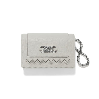 Brighton wallet in pebbled light gray leather with silver-tone knot clasp, woven trim, and chain wristlet on a white background