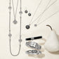 Brighton silver-plated jewelry collection styled with Celtic knot pendants and a white pear on a neutral background