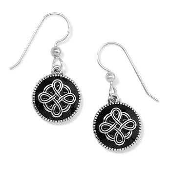 Brighton drop earrings with black round discs featuring silver-plated Celtic knot design and beaded edges on a white background