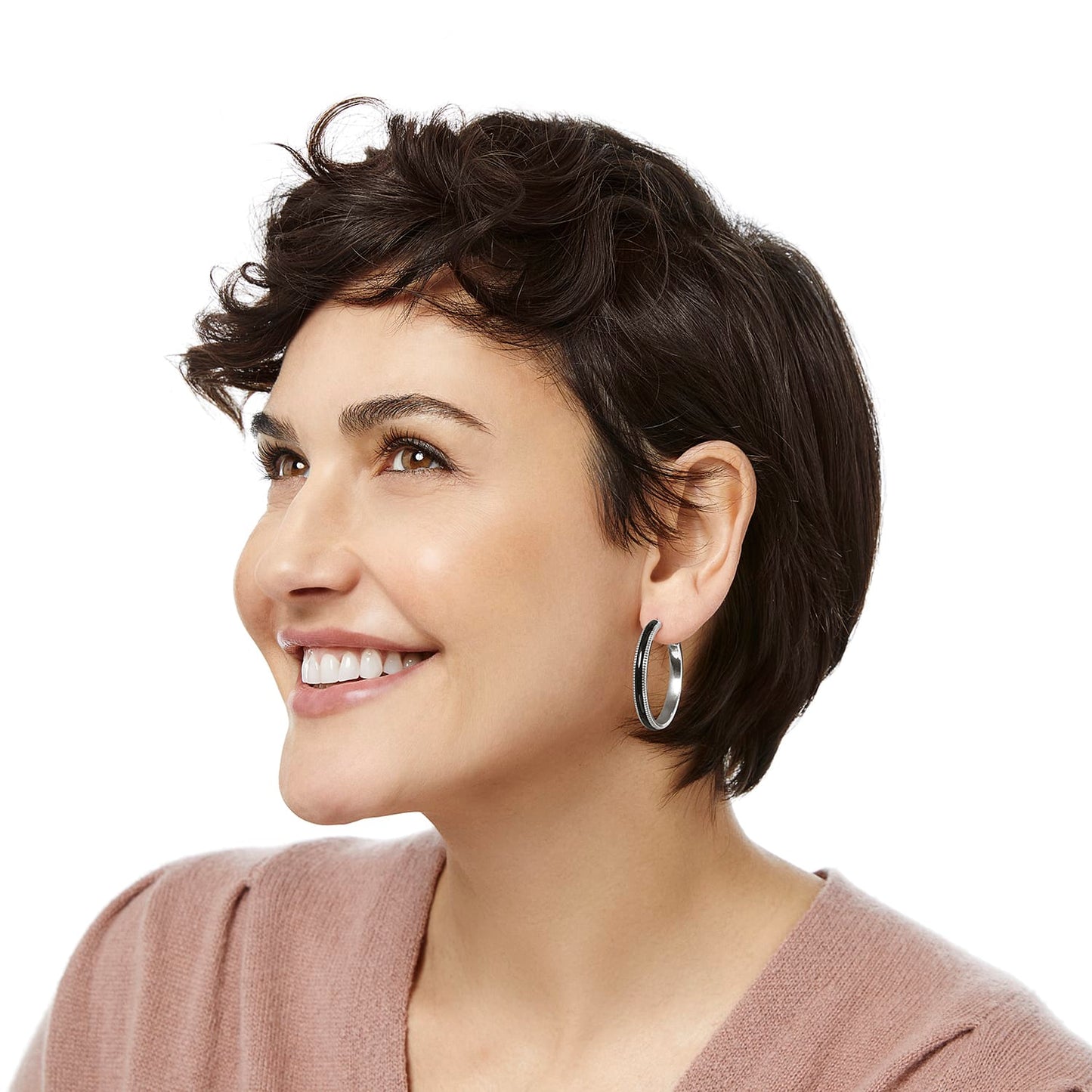 Model wearing Brighton silver-plated hoop earrings with black enamel detailing along the outer edge