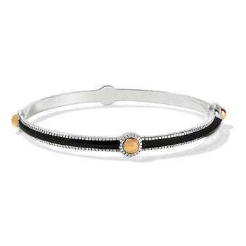 Brighton bangle bracelet with black enamel inlay, two-tone finish, and gold-tone dot accents on a white background
