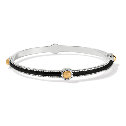 Brighton bangle bracelet with black enamel inlay, two-tone finish, and gold-tone dot accents on a white background