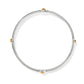 Brighton bangle bracelet with silver-tone enamel band and four gold-tone ball accents on a white background