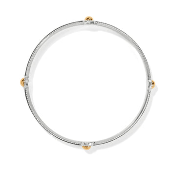 Brighton bangle bracelet with silver-tone enamel band and four gold-tone ball accents on a white background