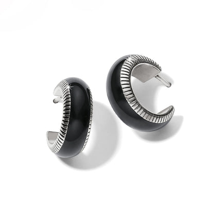 Brighton hoop earrings with black enamel and silver-plated ribbed edge detailing on a white background