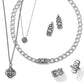 Brighton silver-plated jewelry set styled with matching Celtic knot necklaces, earrings, and rings on a white background