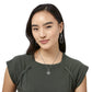 Model wearing a Brighton silver-plated knot pendant necklace paired with matching silver-plated teardrop knot drop earrings