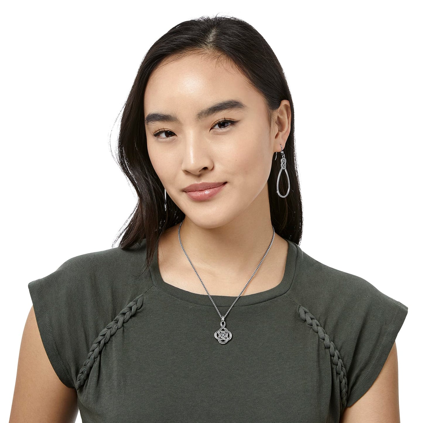 Model wearing a Brighton silver-plated knot pendant necklace paired with matching silver-plated teardrop knot drop earrings