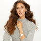 Model wearing a Brighton silver-plated watch with round white dial and chain-link bracelet, paired with knot earrings