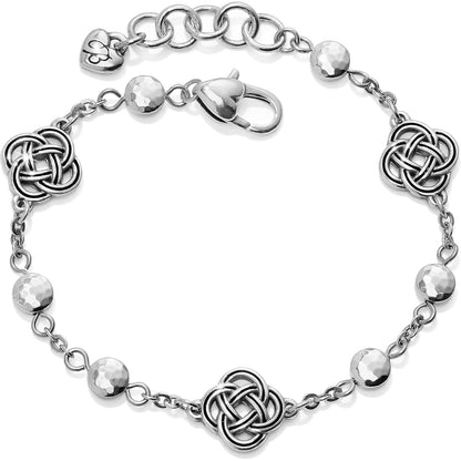 Brighton bracelet with silver-plated Celtic knot stations, hammered round beads, and lobster clasp on a white background