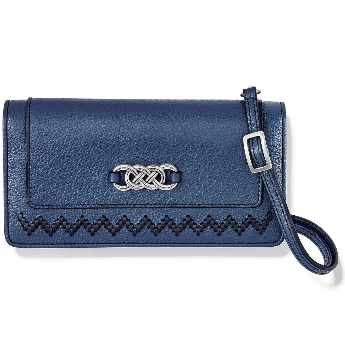 Brighton navy leather wristlet wallet with silver-tone interlocking knot emblem and zigzag stitching on a white background